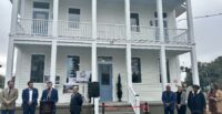 Officials from the city of Charleston and Charleston Redevelopment Corp. dedicate four new housing units at 89 Fishburne St. (Photo/City of Charleston)