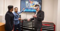 Researchers Arvind Kolangarakath, Kapil Chalil Madathil and Jeff Bertrand (l-r) demonstrate how virtual reality will be used to advance the battery manufacturing workforce. (Photo/Clemson University)