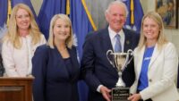 Boeing’s 787 Dreamliner, assembled in North Charleston, was named the 2026 Coolest Thing Made in South Carolina after a global vote. Pictured are Stephanie DeFreese from Blue Cross Blue Shield of South Carolina. SCMC’s Sara Hazzard, Gov. Henry McMaster and Boeing's Jessica Williford. (Photo/SCMC)