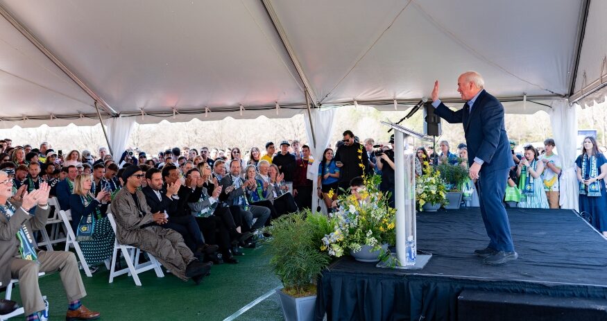 Joe Erwin, chairman and owner of Greenville Triumph SC and Greenville Liberty SC, addressed an enthusiastic crowd during the March groundbreaking ceremony in Mauldin. Attendees included Ronaldo de Assis Moreira — Ronaldinho — sitting on the front row, far left in the center section. (Photo/Sarah Marko)