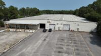 Chuck Salley, Thomas Beard and John Peebles, of Colliers South Carolina brokered the lease of an approximately 62,812-square-foot warehouse at 150 Queen Parkway in West Columbia to Stroud Supply. (Photo/Colliers South Carolina)